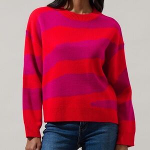 New with tags. Red and pink zebra sweater. Multiple sizes